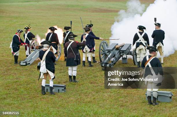 Revolutionary War re-enactors re-create the cannon fire and subsequent cease-fire of the British army, in which they flew the white flag requesting a...