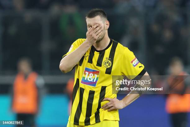 Niklas Sule of Borussia Dortmund looks dejected during the Bundesliga match between Borussia Mönchengladbach and Borussia Dortmund at Borussia-Park...