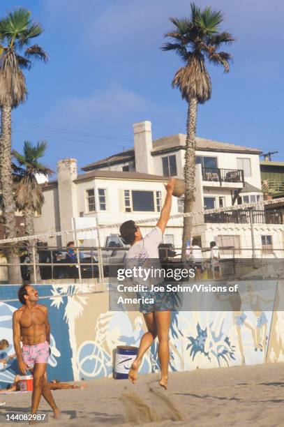 Playing Volleyball on beach, Manhattan Beach, CA