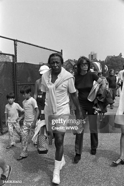 Photojournalist Gordon Parks playing tennis at Forest Hills Stadium in New York to benefit the RFK Memorial Foundation.