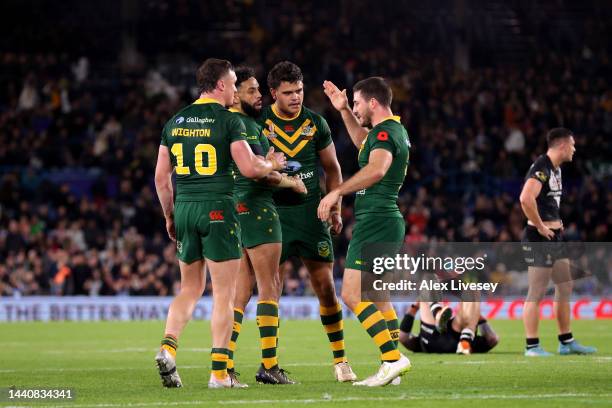 Players of Australia celebrate following the Rugby League World Cup Semi-Final match between Australia and New Zealand at Elland Road on November 11,...