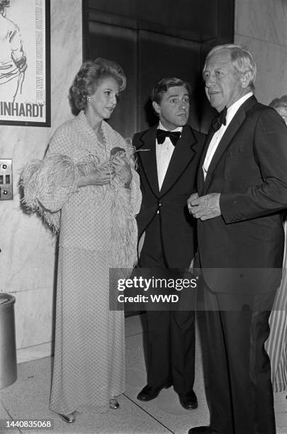 Babe Paley, Mario Amaya and Bill Paley attending Max Reinhardt art opening