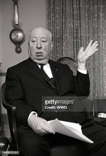 Director Alfred Hitchcock being interviewed in his Los Angeles office