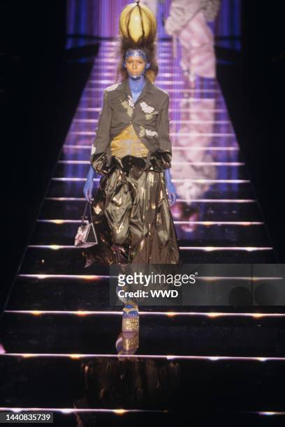 Drawstring army green miltary jacket with embroidered accentsw and satin paper bag skirt in the John Galliano Spring/Summer 2003 Ready-to-Wear show...