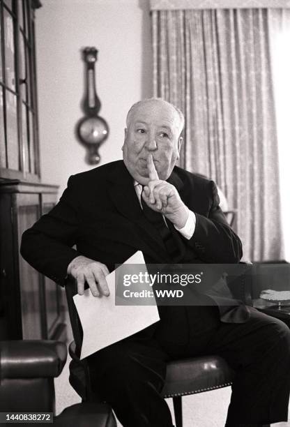 Director Alfred Hitchcock being interviewed in his Los Angeles office