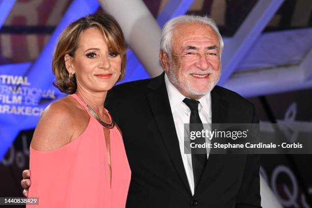 Myriam L'Aouffir and Dominique Strauss-Kahn attend the opening ceremony during the 19th Marrakech International Film Festival on November 11, 2022 in...