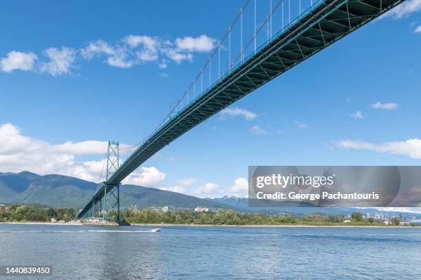 lions gate bridge in vancouver, canada - vancouver lions gate stock pictures, royalty-free photos & images