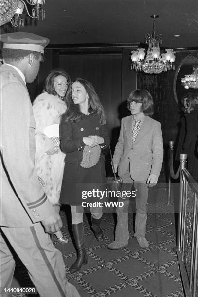 Lee Radziwill with daughter Anna Christina and John Kennedy Jr. At a screening of "The Day of the Dolphin" at the Ziegfeld Theater in New York