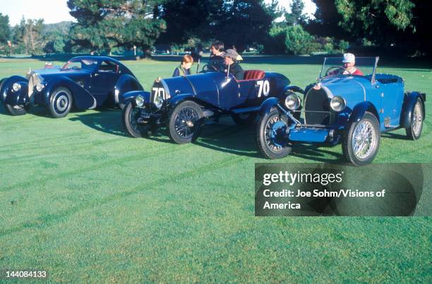 Three blue Bugatti cars at the 35th Annual Concours D' Elegance Competition in Carmel, CA