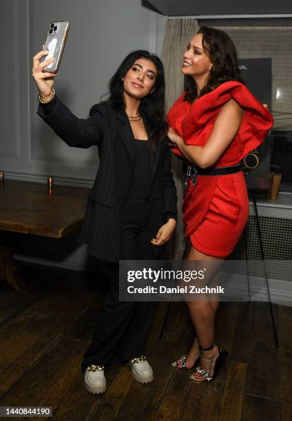 Actress Carolina Miranda poses with guests during the screening of "La Mujer Del Diablo 2" on November 11, 2022 in New York City.