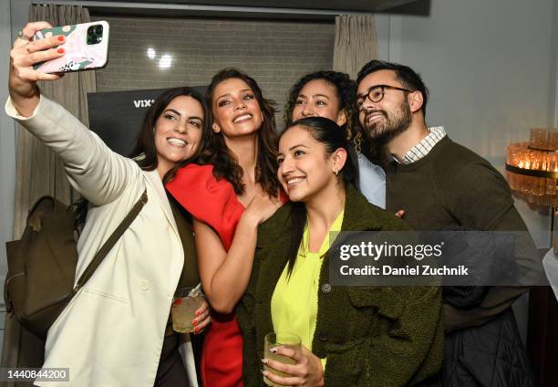 Actress Carolina Miranda poses with guests during the screening of "La Mujer Del Diablo 2" on November 11, 2022 in New York City.
