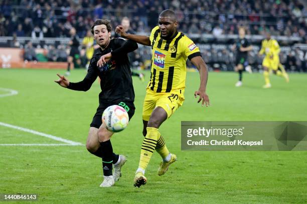 Joe Scally of Moenchengladbach challenges Anthony Modeste of Dortmund during the Bundesliga match between Borussia Mönchengladbach and Borussia...