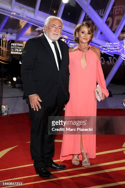 Dominique Strauss-Kahn and Myriam L'Aouffir attends the opening ceremony for the 19th Marrakech International Film Festival on November 11, 2022 in...