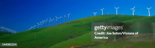 These are windmills along Route 580 at the Altamont Pass, It is a form of wind energy or alternative energy, It is springtime.