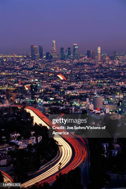 This shows the Hollywood Freeway and skyline at dusk, It is the view from Mulholland Drive.