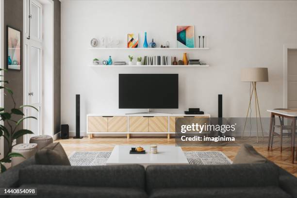 scandinavian style modern living room with entertainment center - woonruimte stockfoto's en -beelden