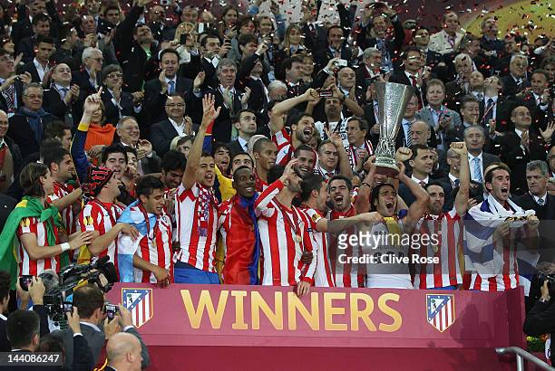 Radamel Falcao of Atletico Madrid holds the trophy aloft with his team mates at the end of the UEFA Europa League Final between Atletico Madrid and...