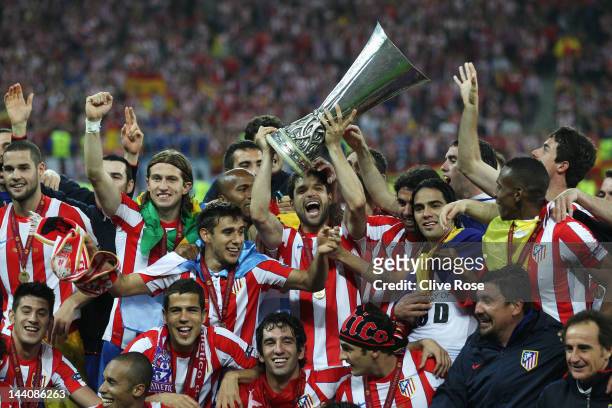 The Atletico Madrid players celebrate with the trophy following their victory at the end of the UEFA Europa League Final between Atletico Madrid and...