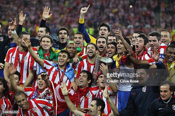 The Atletico Madrid players celebrate with the trophy following their victory at the end of the UEFA Europa League Final between Atletico Madrid and...