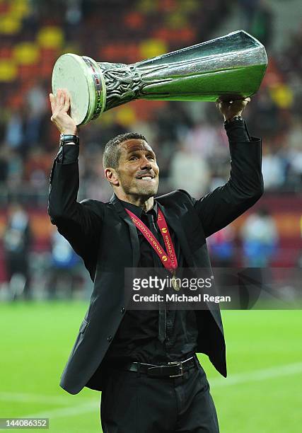 Atletico Madrid Coach Diego Simeone holds the trophy aloft at the end of the UEFA Europa League Final between Atletico Madrid and Athletic Bilbao at...