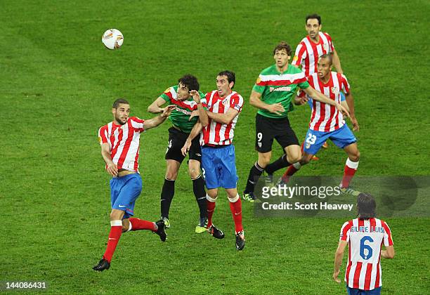 Diego Godin of Atletico Madrid competes with Javi Martínez of Athletic Bilbao during the UEFA Europa League Final between Atletico Madrid and...