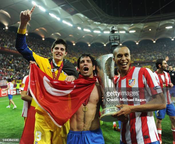 Thibaut Courtois of Atletico Madrid celebrates victory with team mates Arda Turan and Miranda at the end of the UEFA Europa League Final between...