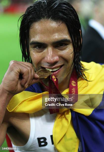 Radamel Falcao of Atletico Madrid bites his winners medal at the end of the UEFA Europa League Final between Atletico Madrid and Athletic Bilbao at...