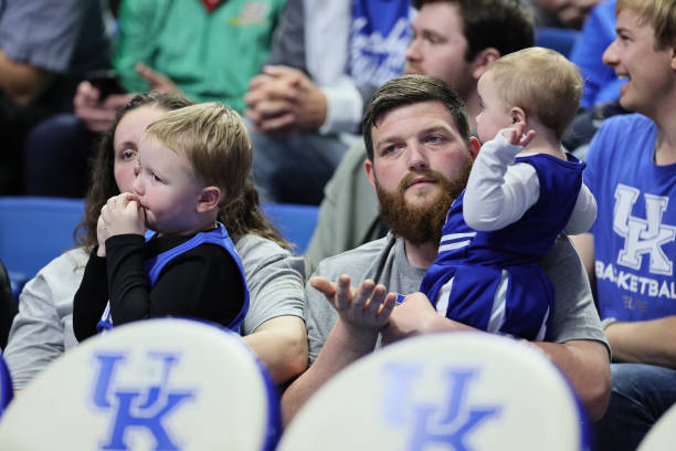 Mollie McGuire , Easton McGuire, Michael McGuire and Linlee McGuire watch the Kentucky Wildcats game against the Duquesne Dukes at Rupp Arena on...