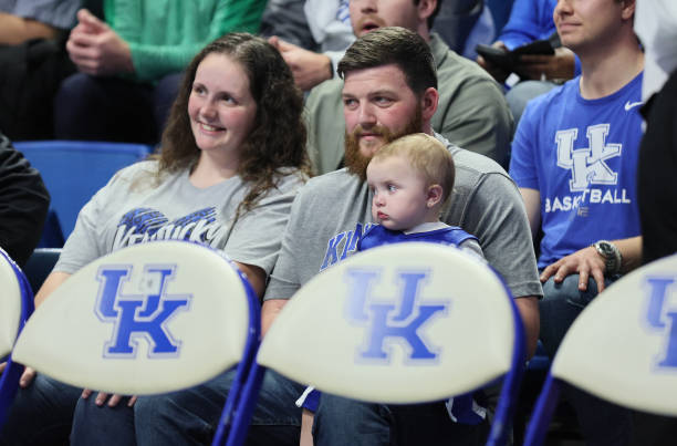 Mollie McGuire , Easton McGuire, Michael McGuire and Linlee McGuire watch the Kentucky Wildcats game against the Duquesne Dukes at Rupp Arena on...