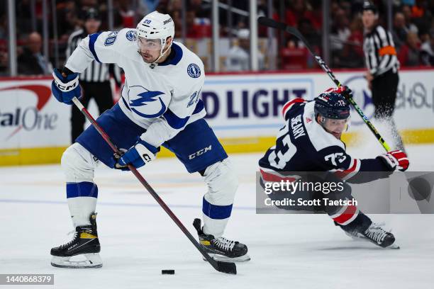Nicholas Paul of the Tampa Bay Lightning handles the puck against Conor Sheary of the Washington Capitals during the third period of the game at...
