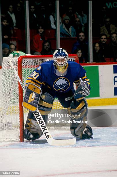 Martin Biron of the Buffalo Sabres attempts follows the action during a game against the Montreal Canadiens Circa 1999 at the Bell Centre in...