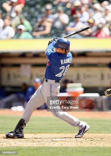 Colby Rasmus of the Toronto Blue Jays hits a single that scored Brett Lawrie in the sixth inning against the Oakland Athletics at O.co Coliseum on...