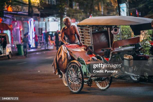 taxi on the road in the city of phnom penh, cambodia - phnom penh stock pictures, royalty-free photos & images