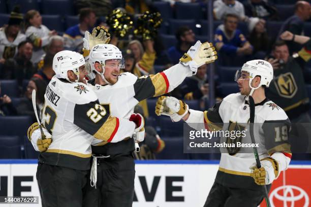 Jack Eichel, Reilly Smith and Alec Martinez of the Vegas Golden Knights celebrate Eichel's third goal during the third period of an NHL hockey game...