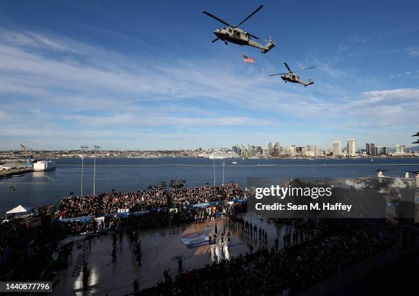 Navy Helicopters fly over the opening ceremony of the Armed Forces Classic aboard the USS Abraham Lincoln between the Gonzaga Bulldogs and the...