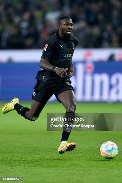 Marcus Thuram of Moenchengladbach runs with the ball during the Bundesliga match between Borussia Mönchengladbach and Borussia Dortmund at...