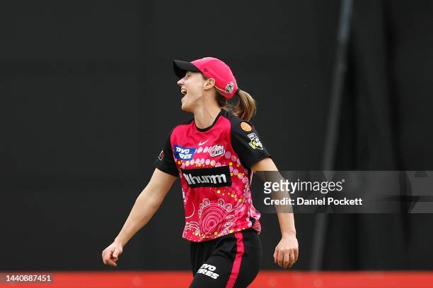 Erin Burns of the Sixers celebrates takes a catch to dismiss Sophie Reid of the Stars during the Women's Big Bash League match between the Melbourne...