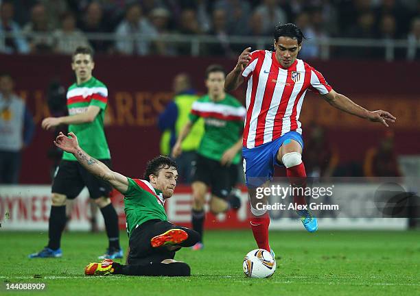 Fernando Amorebieta of Athletic Bilbao challenges Radamel Falcao of Atletico Madrid during the UEFA Europa League Final between Atletico Madrid and...