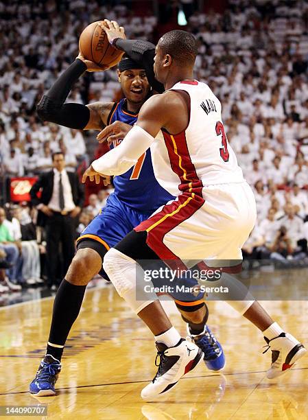 Guard Dwyane Wade of the Miami Heat defends Forward Carmelo Anthony of the New York Knicks in Game Five of the Eastern Conference Quarterfinals in...