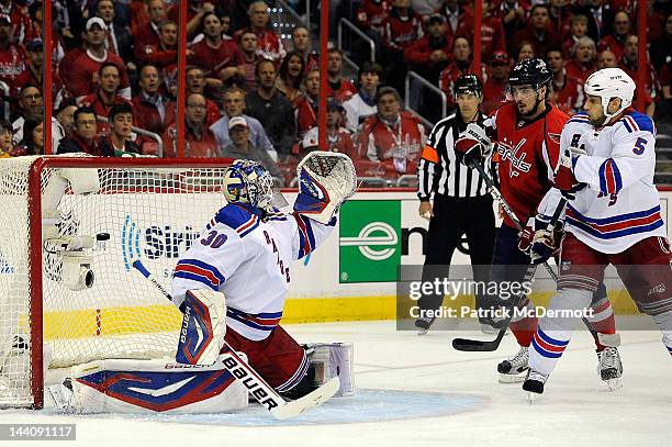 Alex Ovechkin of the Washington Capitals scores a goal against Henrik Lundqvist of the New York Rangers as Marcus Johansson and Dan Girardi battle in...