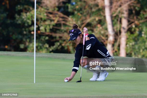 Hikari Fujita of Japan lines up a putt on the 18th green during the play off following the final round of the Yamaguchi Shunan Ladies Cup at Shunan...