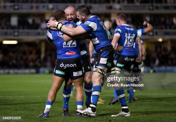 Tom Dunn of Bath Rugby celebrates their side's win with teammates Ollie Lawrence and Fergus Lee-Warner of Bath Rugby after the final whistle of the...
