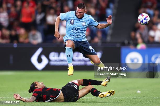 Robert Mak of Sydney FC is challenged by Gabriel Cléùr of the Wanderers during the round six A-League Men's match between Sydney FC and Western...