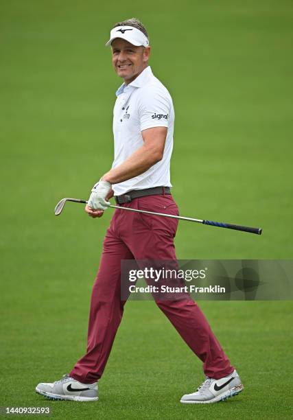 Luke Donald of England reacts to his approach shot on the 10th hole during the weather delayed second round during Day Three of the Nedbank Golf...