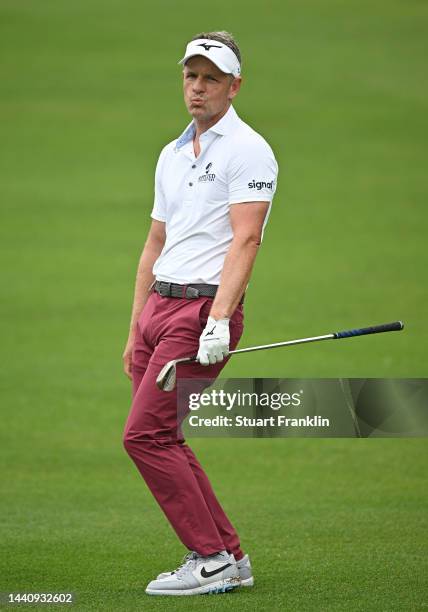 Luke Donald of England reacts to his approach shot on the 10th hole during the weather delayed second round during Day Three of the Nedbank Golf...