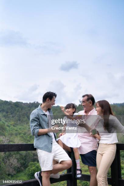 family gathering - chinese family taking photo at home stock pictures, royalty-free photos & images