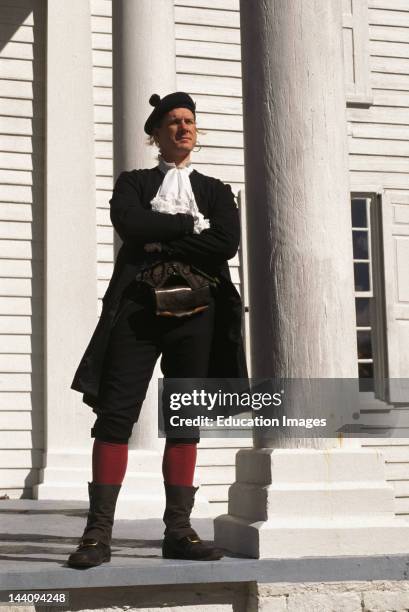 South Carolina, Myrtle Beach, Man Dressed In Period Costume Standing In Front Of A Historic Plantation House.
