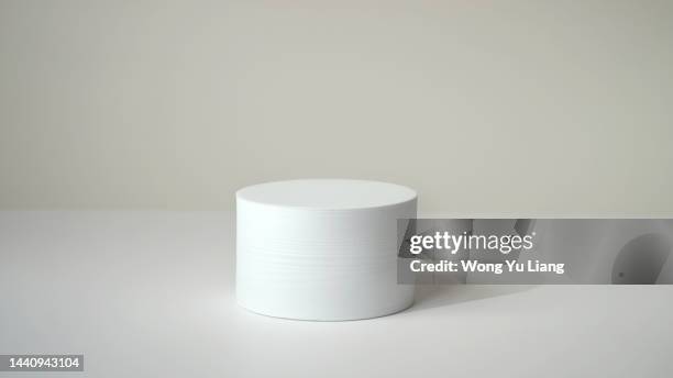 white podium on white background - white studio stock pictures, royalty-free photos & images