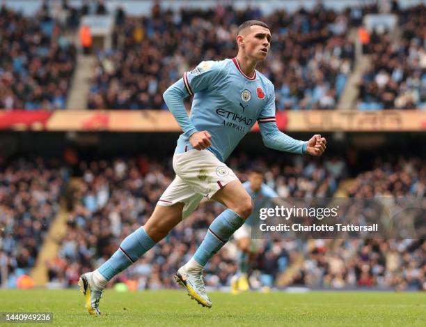 Phil Foden of Manchester City celebrates after scoring their team's first goal during the Premier League match between Manchester City and Brentford...