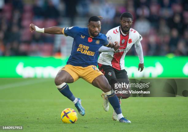 Allan Saint-Maximin of Newcastle United in action with Ainsley Maitland-Niles of Southampton the Premier League match between Southampton FC and...